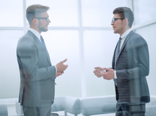 business partners talk in the office.