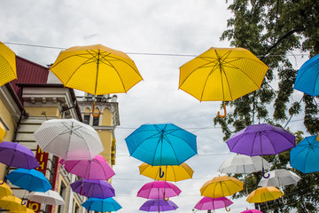 Fototapeta na wymiar urban city outdoor street decoration concept with colorful umbrellas
