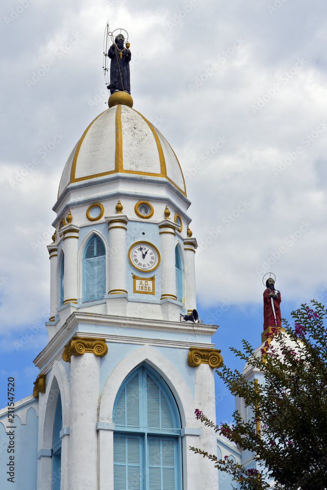 Wall mural old white and blue church tower