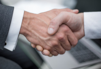 close up. handshake business partners.
