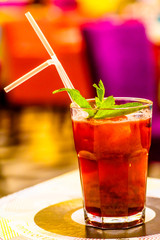 Berry lemonade with mint in a glass.