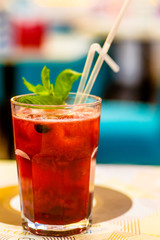 Berry lemonade with mint in a glass.