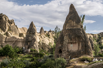 Naklejka premium Cave house of Fairy Chimneys rocks mushroom in Pasabag, Monks Valley, Cappadocia, Turkey.