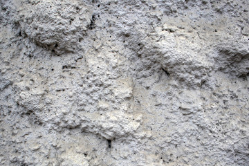 Porous spongy gray facing stone texture, may be used as background