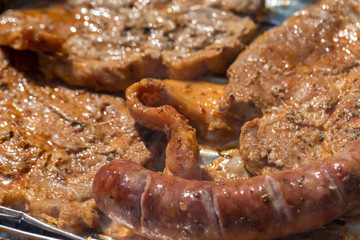 Unhealthy but tasty grilled sausages and meat