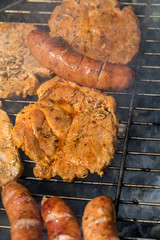Unhealthy but tasty grilled sausages and meat