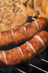 Unhealthy but tasty grilled sausages and meat
