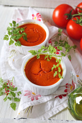 Vegetable appetizer: tomato soufflе, bunch of tomatoes and olive oil, two servings