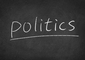 Obraz premium politics concept word on a blackboard background