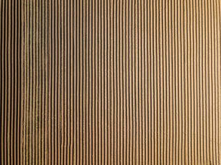 Obraz premium Spring arable land. Field and beautiful patterns from the tractor. View from above. 