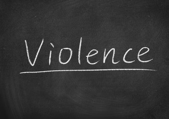violence concept word on a blackboard background