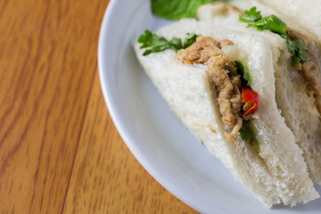 bread sandwich with tuna fish, slices on plate