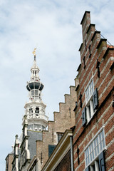 Tower of the former cityhall surrounde by crow-step gables