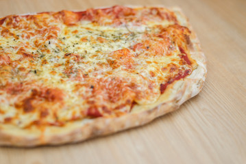 Pizza calzone time on light wooden table background