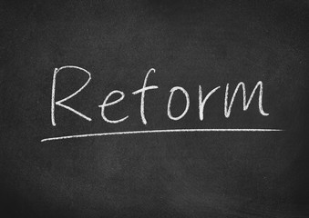 reform concept word on a blackboard background