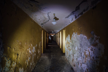 Dark creepy corridor of abandoned building