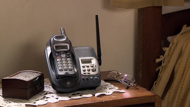 Cordless Phone on the Bedside Table, Close-Up, Zoom In