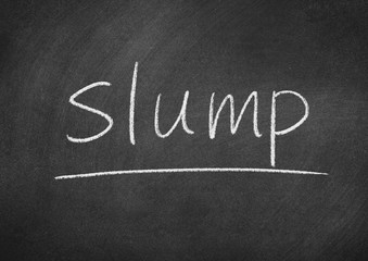 slump concept word on a blackboard background
