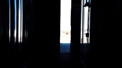 Warehouse Worker Closing and Opening Metal Door. Iron Tone.  