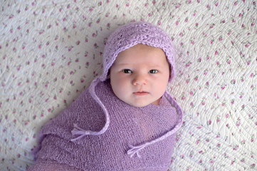 Fototapeta na wymiar Baby Girl with a Lavender Bonnet