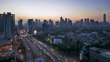 Beautiful cityscape with busy road at sunset time
