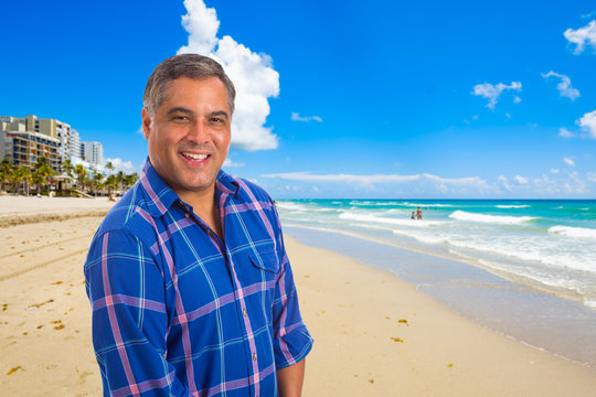 Handsome Hispanic man at the beach