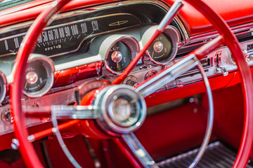 Shallow depth of field closeup detail of a vintage American car dashboard