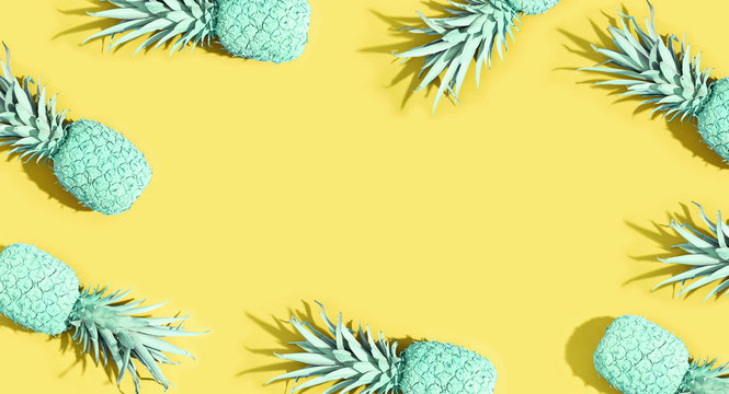 Painted pineapples on a vivid color background
