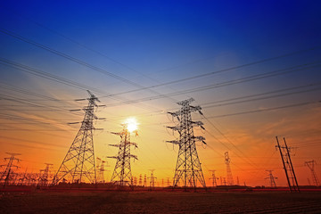 Fototapeta premium Electric tower, silhouette at sunset