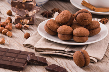Hazelnut shortbread sandwiches filled with chocolate cream. 