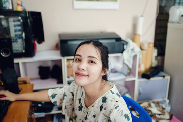 Fototapeta na wymiar Asia girl smile at home work