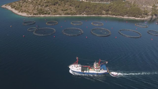 Aerial view of fish farm with cargo ship - Adriatic sea, Croatia