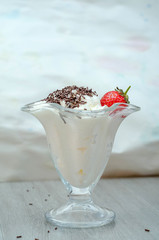 cream with strawberries in the bowl
