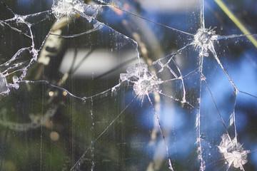 broken glass with cracks and reflections