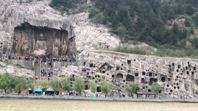 Panning view of the Longmen Grottoes in Luoyang, China