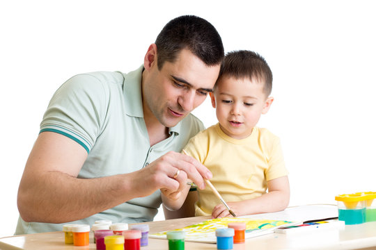 Father and child son playing with paint colors
