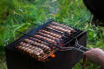 Lulya kebab from meat are prepared in the grill. Shish kebab in the grill.