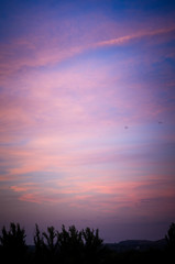 Fototapeta premium Landscape with dramatic light - beautiful golden sunset with saturated sky and clouds.