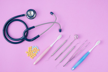 Medical concept. Stethoscope on the blue background. Top view, flat lay.