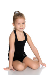 The gymnast prepares to perform the exercise.