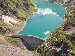 Aerial view of the dam of the Lake Barbellino, an Alpine artificial lake. Italian Alps. Italy