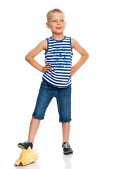 A little boy with a sea shell.