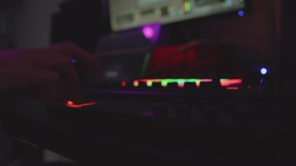 Music producer making a beat in dark room