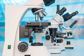 Four microscopes of different designs in the laboratory