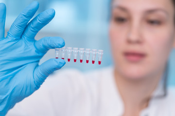 Young woman with genetic research in the laboratory research of cancer diseases