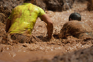 Mud race runners,during extreme obstacle races