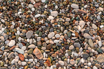 Pebbles on the beach,  pebble beach.