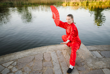 women practicing yoga and tai chi outdoors