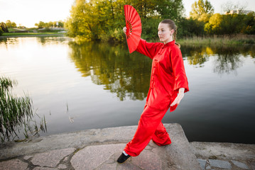 women practicing yoga and tai chi outdoors