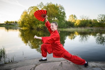 women practicing yoga and tai chi outdoors